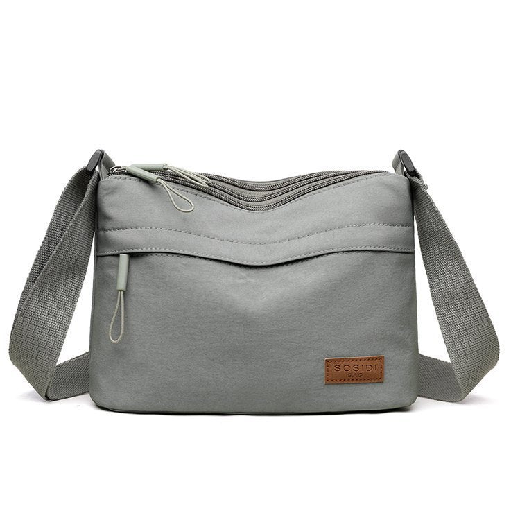 Schultertasche mit wasserabweisendem Stoff – leicht & vielseitig