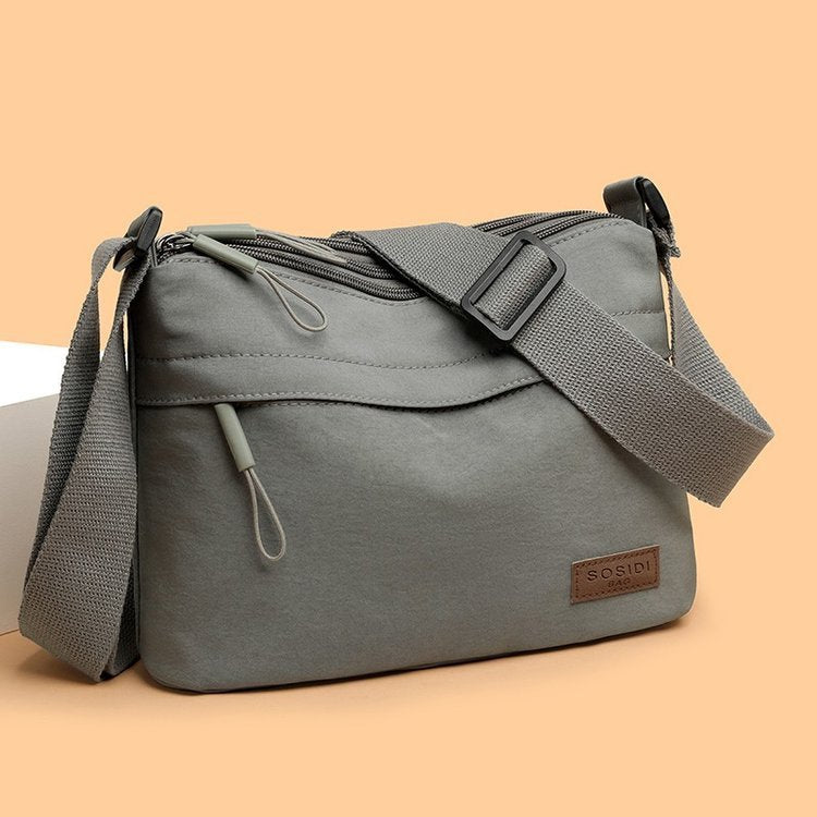 Schultertasche mit wasserabweisendem Stoff – leicht & vielseitig